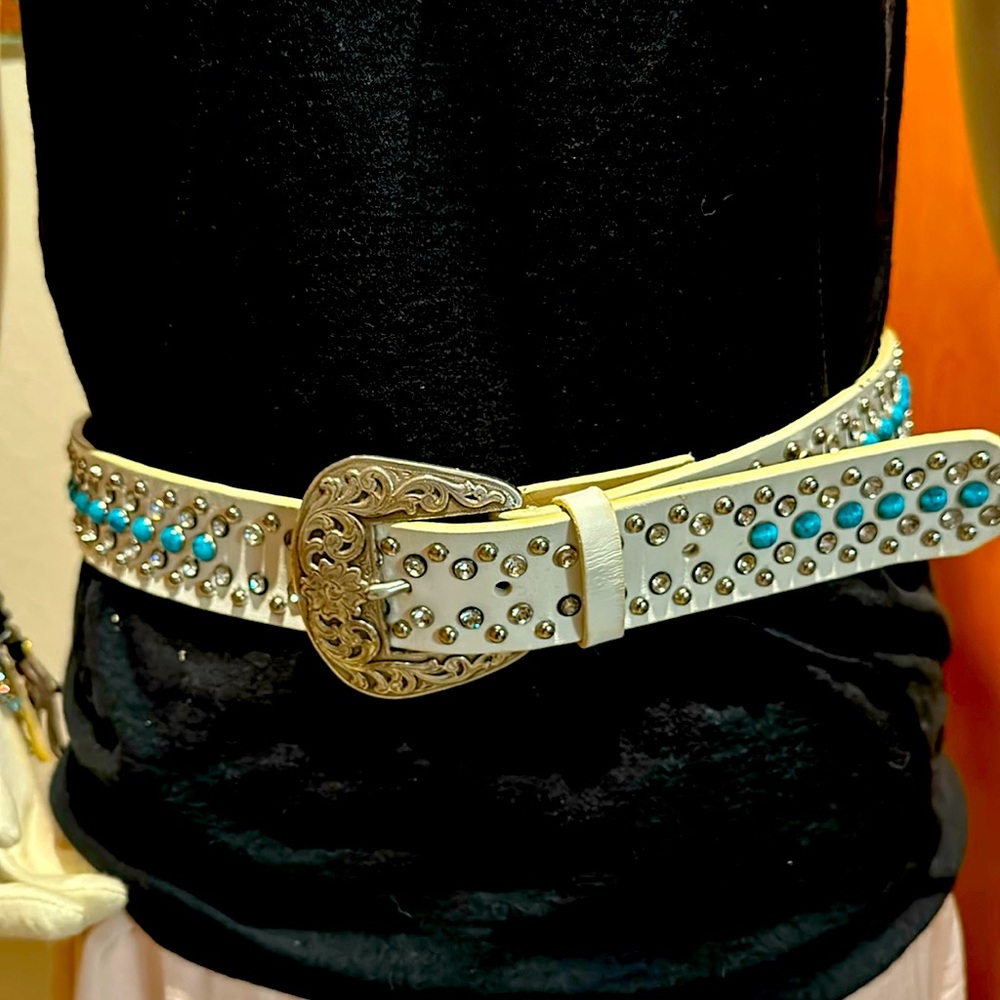 White 1 and 1/2” wide crystal and turquoise colored stones western belt